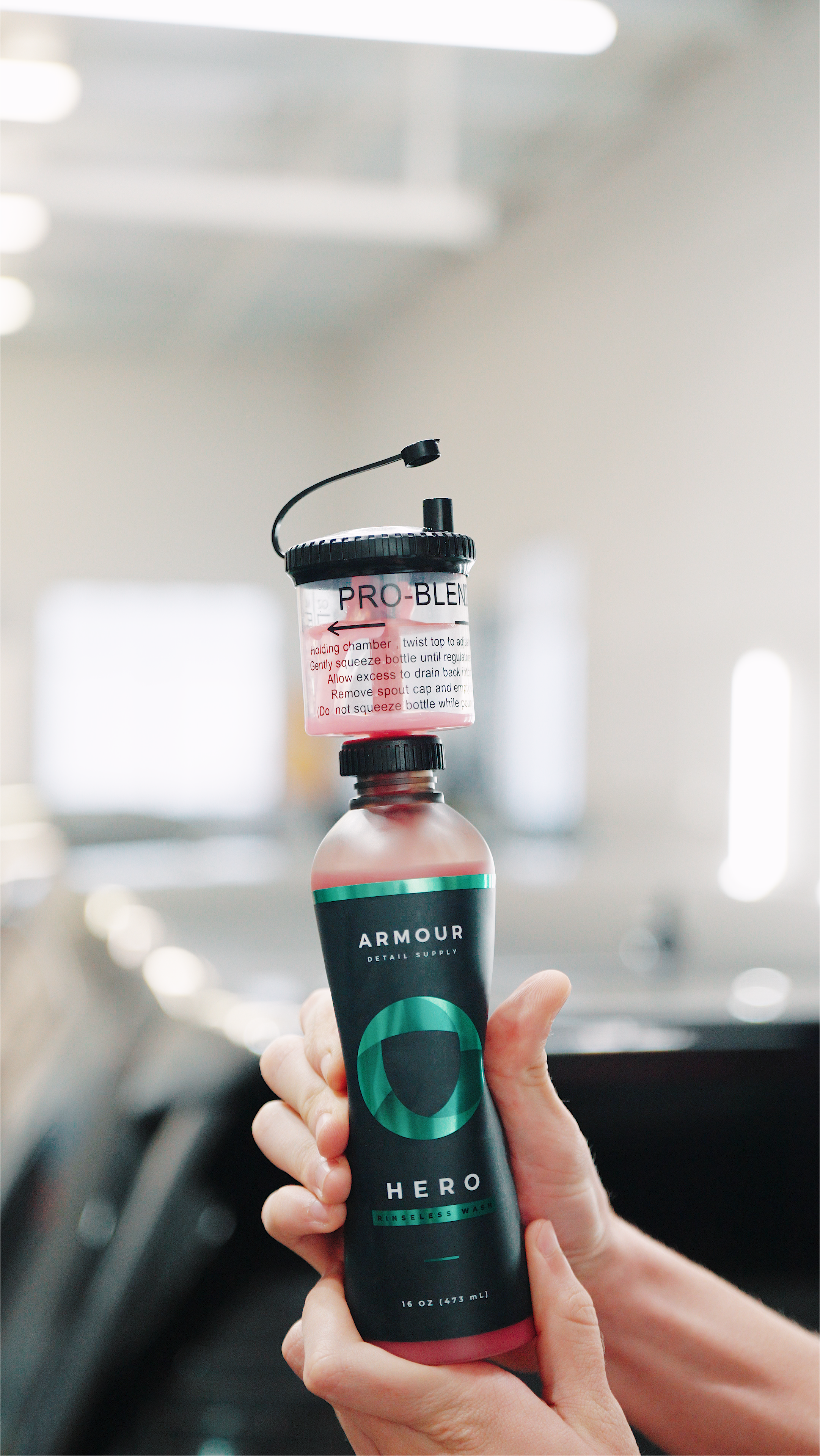 Armour Pro-Blend Bottle Proportioner — shown in use during a vehicle detail